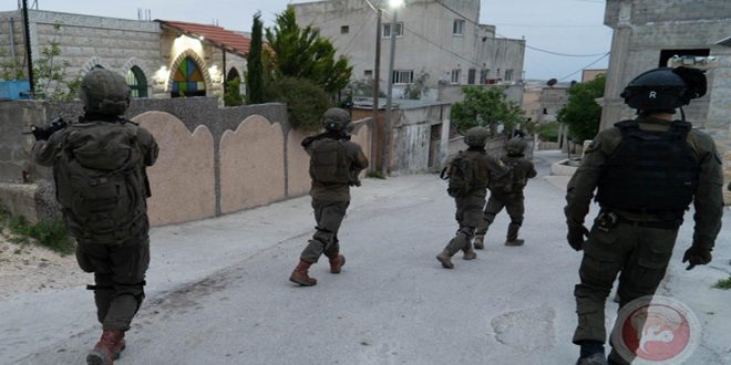Israeli occupation forces arrest two Palestinians in the West Bank