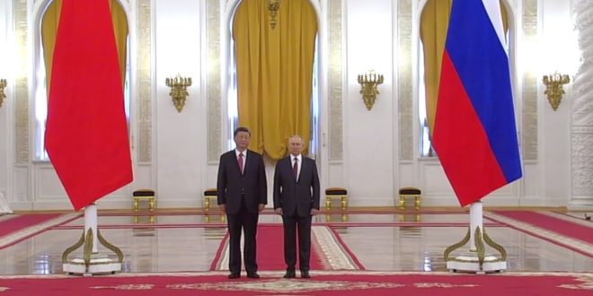 Putin, Xi holding talks with delegation members